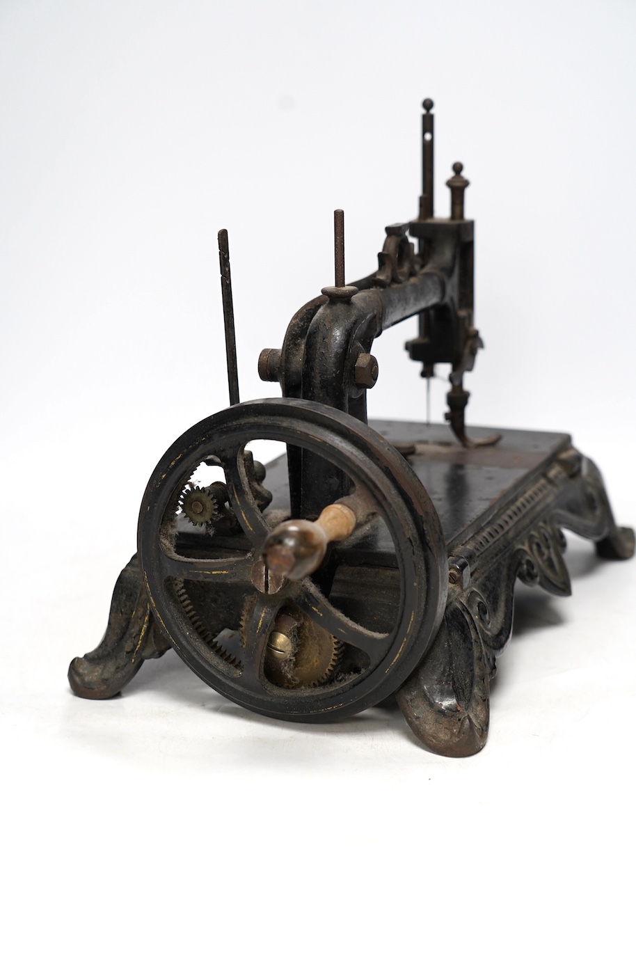 A late 19th century Atlas Brunonia sewing machine with decorative cast iron base. Condition - fair